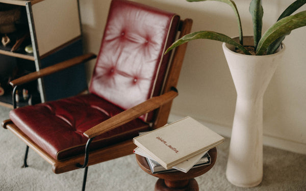 A mid-century modern chair with a footstool