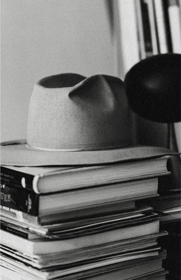 A hat atop a stack of books