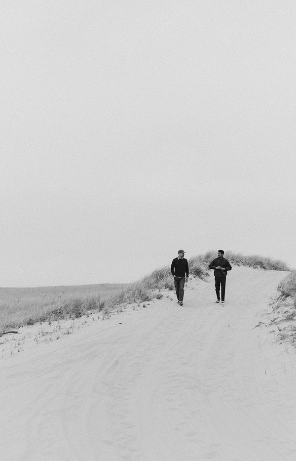 Models walking along the sand dunes in Wellfleet, MA