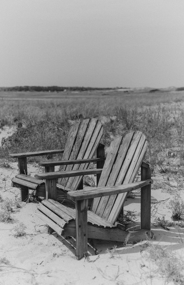 Wooden beach chairs on the sand dunes in Wellfleet