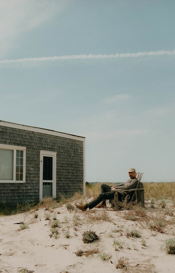 Model sitting by the sand dunes in Wellfleet, MA
