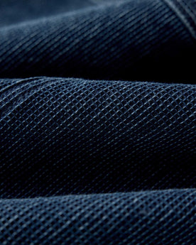 Close up of the waffle fabric on The Long Haul Jacket in Rinsed Indigo Waffle, Outerwear by Taylor Stitch