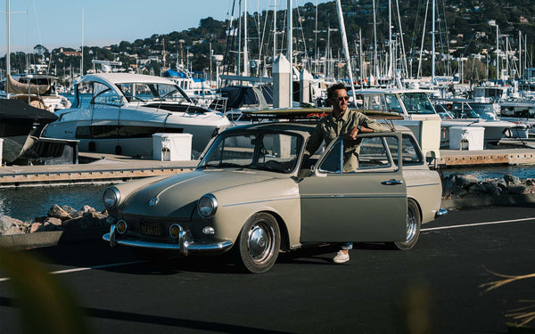 Model holding a cup of coffee in the 1964 Timex Electric.