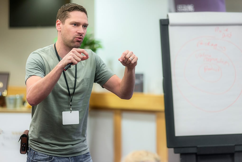 Robin speaking at a conference