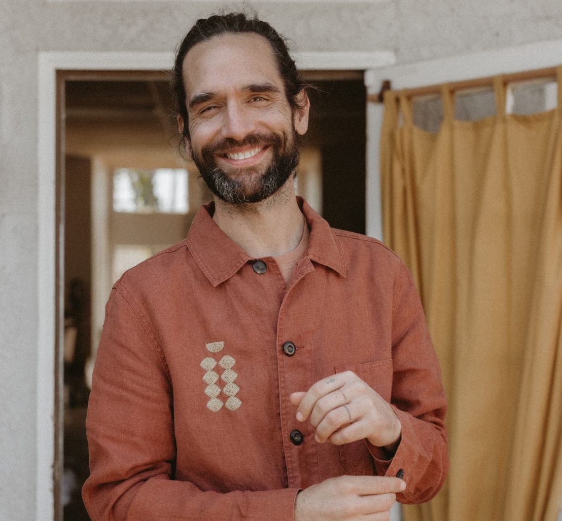 Daren smiling in The Embroidered Ojai Jacket in Dried Guajillo
