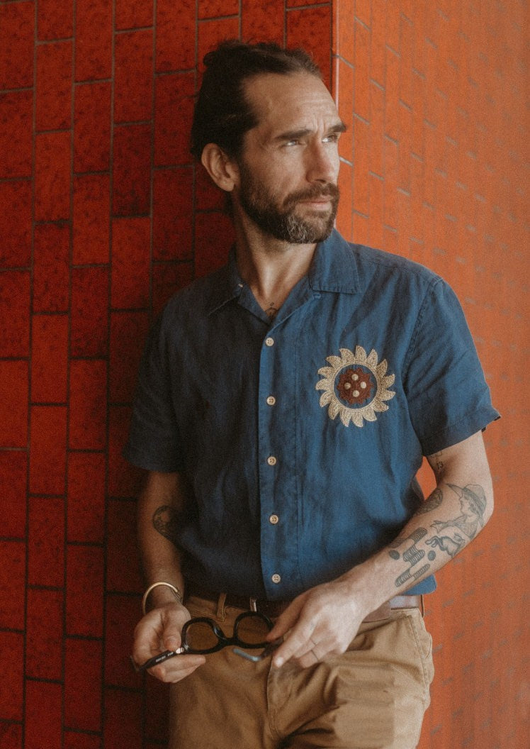 Daren looking off to the side in The Embroidered Hawthorne in Sea Glass Hemp