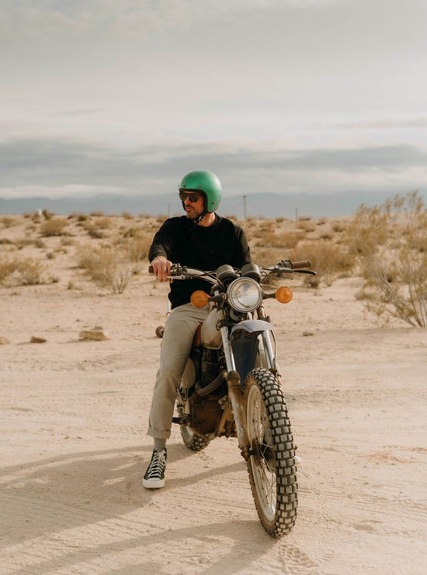 Model on a bike in the desert