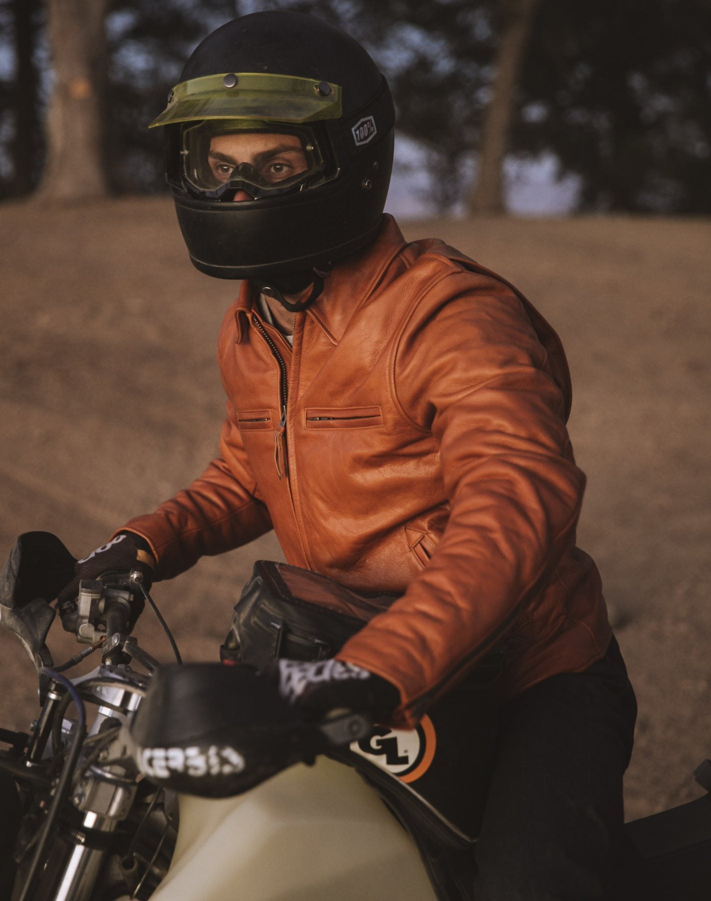 Wilderness Collective member riding in The Moto Jacket in Whiskey Steerhide