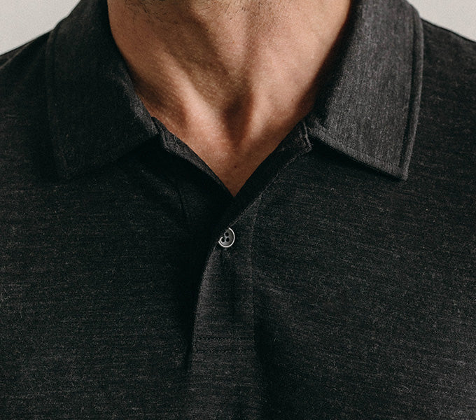 Model wearing The Merino Polo in Heather Black