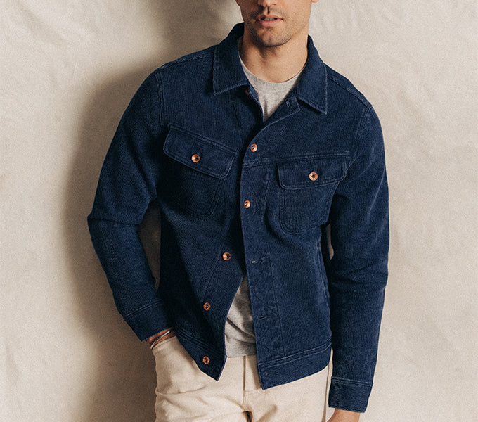 Model wearing The Long Haul Trucker Jacket in Rinsed Indigo Waffle